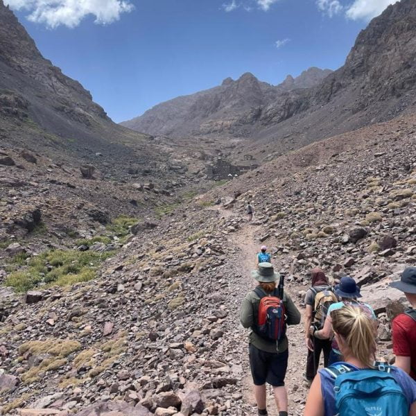 A group of travellers making their way across the Mount Toubkal National Park towards the highest peak in the North of Africa. Mount Toubkal Trek Morocco