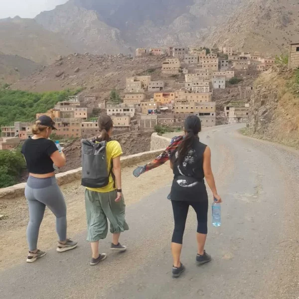 A group trekking the trails in the Mount Toubkal National Park, heading to the next mountain village on their way. Mount Toubkal Trek Morocco